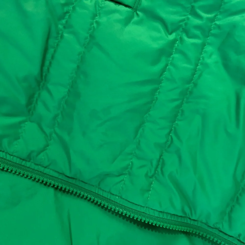 The North Face Vibrant Green Jacket for Spring and Fall Weather.